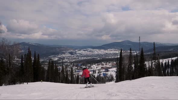 Beginning Skier Skiing On Ski Piste In Hilly Mountains At Winter In Movement alt