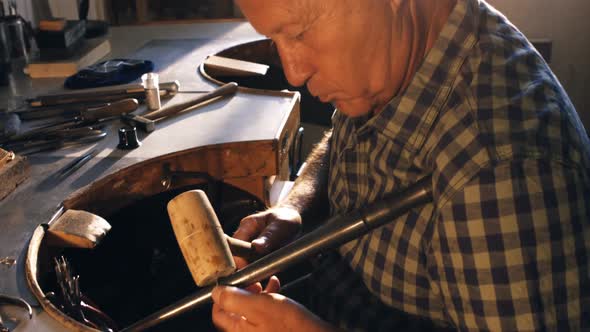 Goldsmith preparing work tool alt