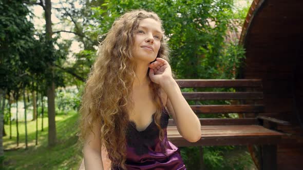 Beautiful Girl Sitting on Veranda River View Resort alt