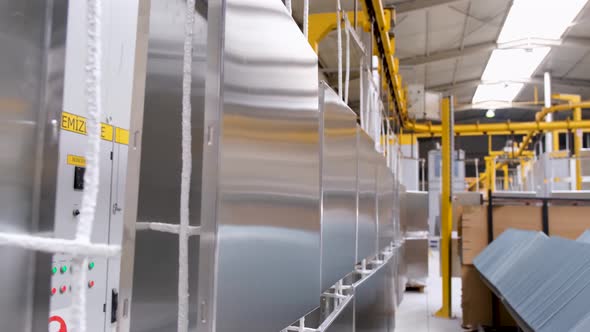 Industrial Painting Units. Industrial Painting of Parts From Spray Guns. Painting Parts in Workshop alt