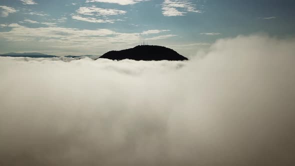 Aerial move towards Bukit Mertajam hill with 4 communication towers alt