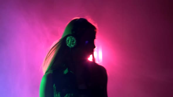 Sexy Blonde Dj Girl Playing and Listening To Music, Smoke, Silhouette, Pink Backlight alt