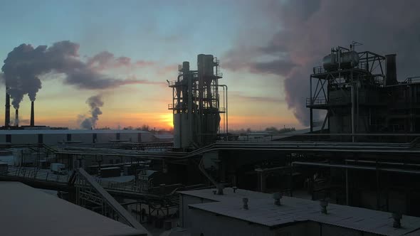 A Wood Processing Plant Pollutes the Air with Smoke From Pipes