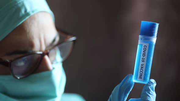 Doctor holding a recipient with the coronavirus COVID-19 vaccine