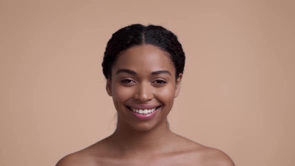 Studio Portrait of Young African American Lady Smiling to Camera Posing with Bare Shoulders Over alt