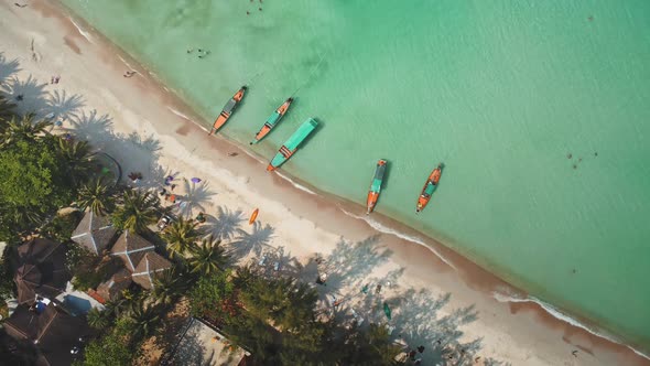 Aerial Top View Rooftops and National Boats Near Sandy Shore alt