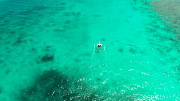 Seascape Coral Reef and Blue Sea with Motorboat alt
