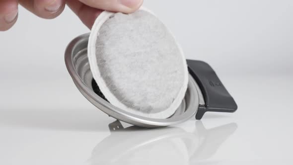 Coffee pod putting on machine holder 4K video alt