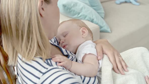Mother with Sleeping Baby alt