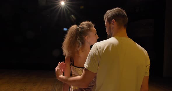 The Guy and the Girl are Having Fun Rehearsing the Dance on the Stage alt