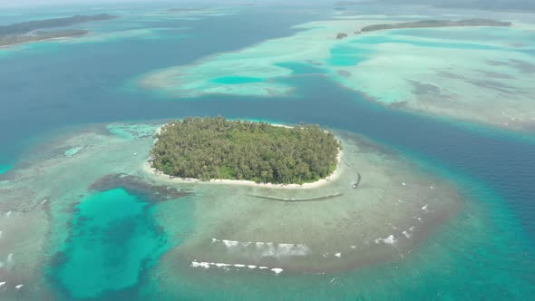 Aerial: flying over tropical island white beach caribbean sea turquoise water co alt