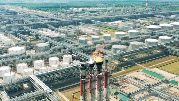 Oilrefining Factory with Constructions and Flare Stacks alt