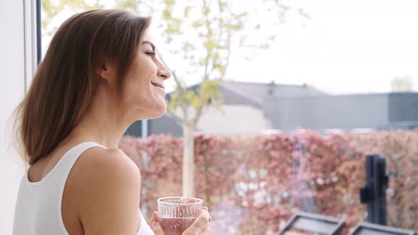 Woman Enjoying Glass of Water