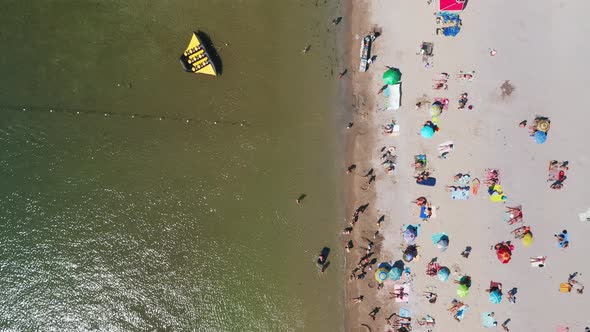 Aerial View of the Beachfront in the Middle of a Hot Summer Day alt