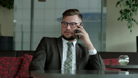 Hr-manager talking by phone in office. alt