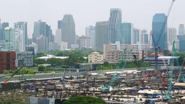 Panoramic View of Cityscape and Construction Site in Metropolis alt