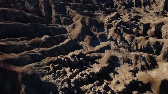 Sunlit star-shaped plateau with road and green valley in Colorado National Monument, Colorado, USA alt