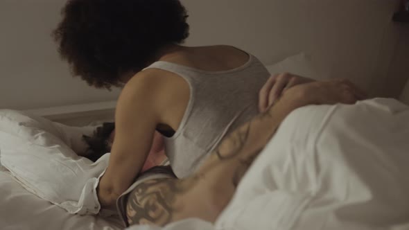 Mixed Race Couple romantic in bed