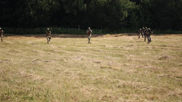 Group of Soldiers with Ammunition and Weapons on the Battlefield Attempting to Attack the Enemy alt