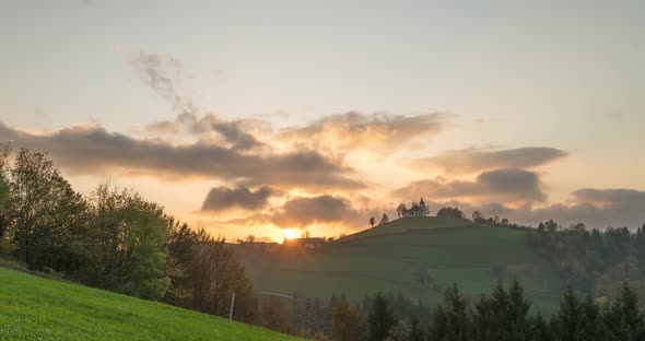  Timelapse View of the Hills, Colorful Forest and the Sv Sobota Church. Slovenia Sunset in Autumn