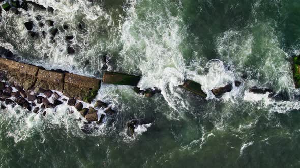 Aerial shoot of the sea wave. Camera hangs over the waves.