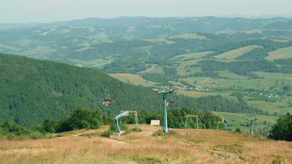 Tourists Enjoy Landscape in Ropeway alt