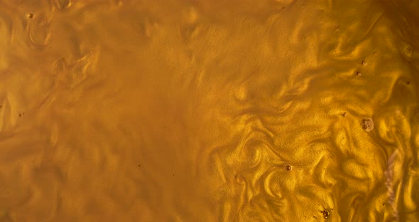 Liquid gold wave background. Golden and abstract backdrop that suits as lava honey or oil alt