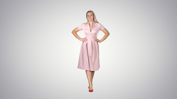 Woman in Dress with Hands on Hips Walking While Looking alt