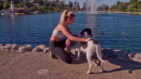 Attractive Woman Playing With Her Dog alt