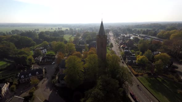 Church in rural area next to road - Drone moving towards alt