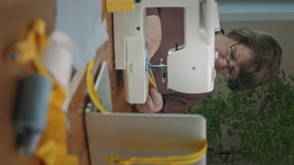 Woman sews at home alt