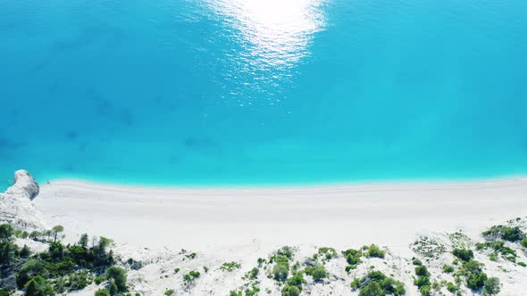Drone view of scenic beach with white sand and turquoise sea, Greek islands. alt