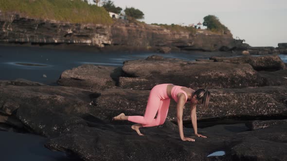 Side View of Sexy Girl in Tight Sportswear Stretch Her Legs and Glutes alt