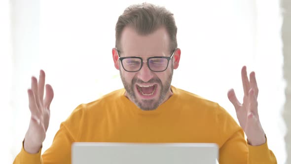 Portrait of Man Shouting While Using Laptop, Stock Footage | VideoHive