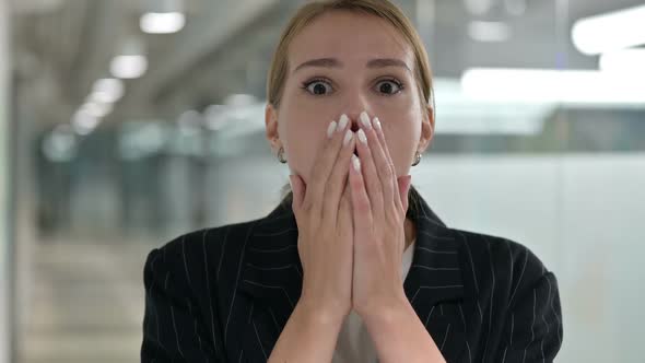 Upset Young Businesswoman Feeling Shocked alt