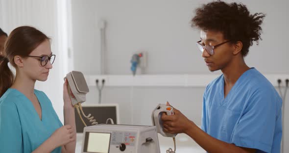 Diverse Interns Learning to Use Defibrillator for Patient Resuscitation alt