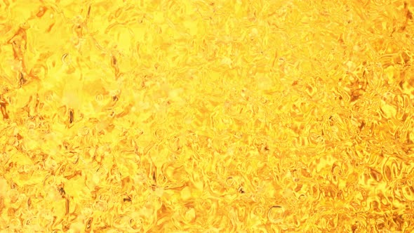 Super Slow Motion Shot of Golden Liquid Luxury Background at 1000Fps alt