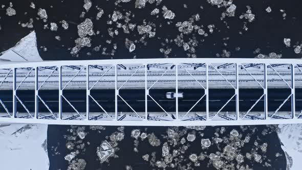 Top down view of river with floe and bridge above alt