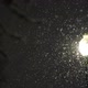 Snow falling lit up by street light at night during storm - VideoHive Item for Sale