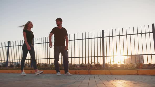 Funny Guy on the Street Raises and Turns the Girl in Arms and Goes Further alt