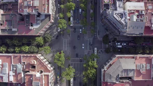 Vehicles Driving Through an Intersection in Barcelona City Bird's Eye View alt