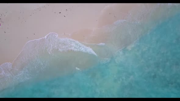 Aerial flying over sky of tropical lagoon beach voyage by transparent ocean with white sandy backgro alt