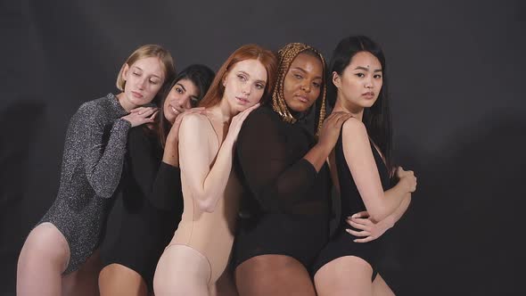 Beautiful Multiethnic Group of Models Posing at Camera alt