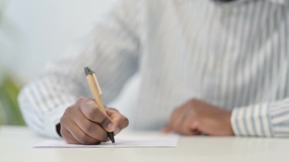 Close Up of African Man Using Smartphone Mobile alt