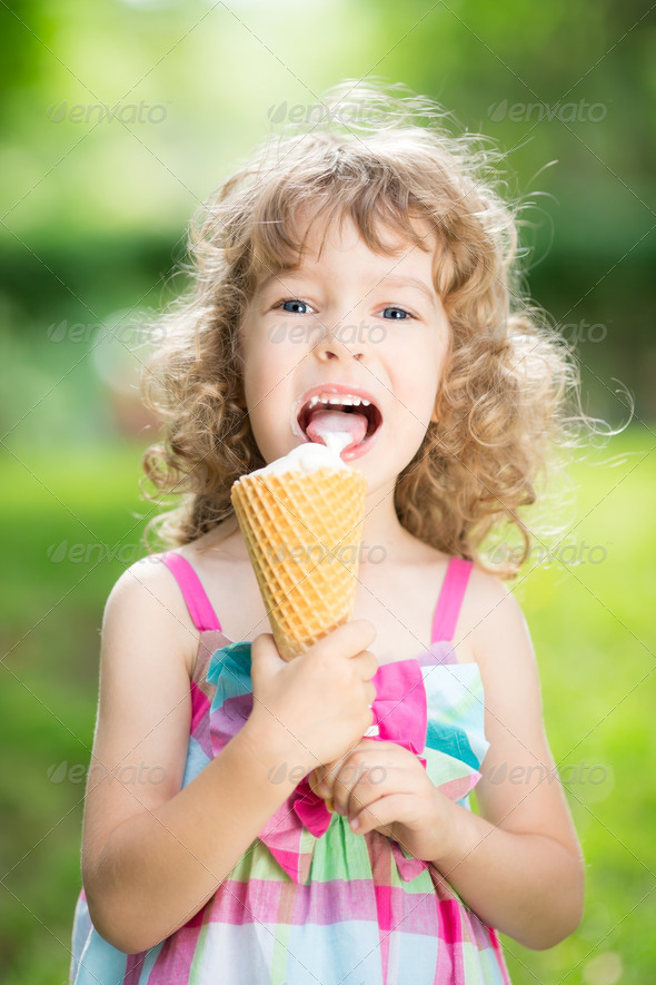 Happy child eating ice cream Stock Photo by Sunny_studio | PhotoDune