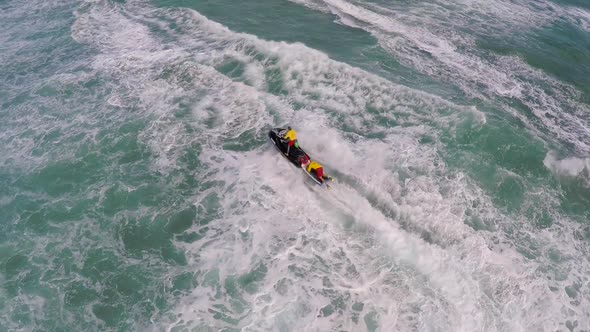 Aerial view of lifeguard surf rescue jet ski personal watercraft in Hawaii alt