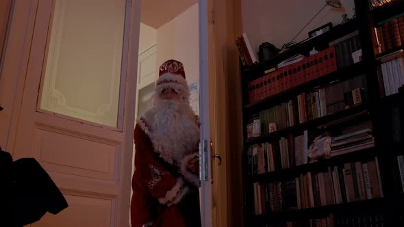 Santa Claus Carefully Enters the House