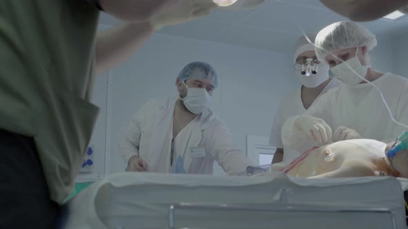 Staff of the Operating Unit Prepares the Patient for Transoprotection to the Ward After the alt