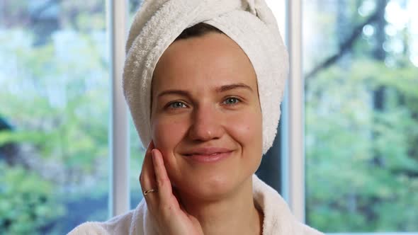 Portrait of a Beautiful Young Woman With a Towel Turban on Her Head