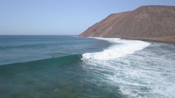 A View From Above of the Surfers in the Ocean